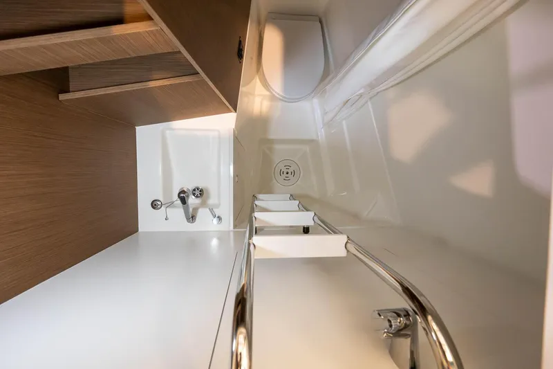  Yacht Photos Pics Modern bathroom in Prestige M48 yacht, 2025 model, featuring sleek fixtures and wooden accents.