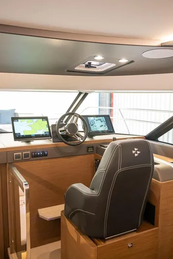  Yacht Photos Pics Prestige M48 2025 yacht helm station with modern navigation systems and luxurious captain's chair.