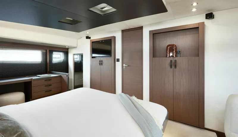  Yacht Photos Pics Luxurious bedroom interior of Prestige M48 yacht, 2025 model, featuring modern design and elegant furnishings.