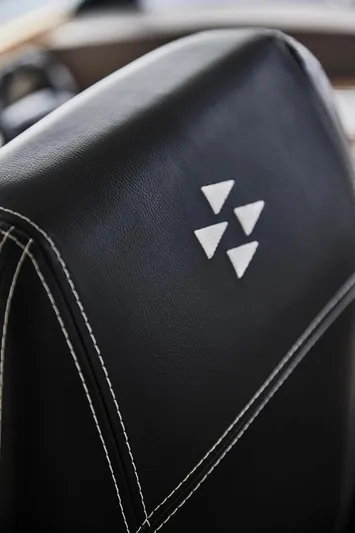  Yacht Photos Pics Close-up of Prestige M48 2025 model's black leather seat with white stitching.