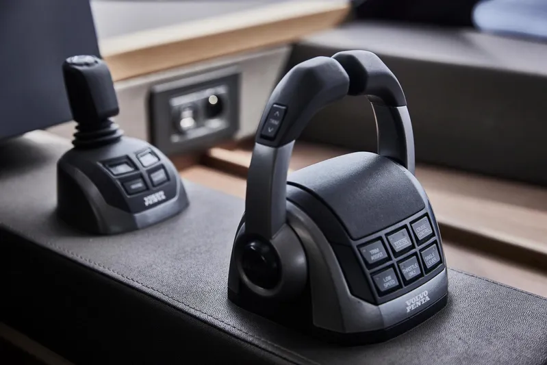  Yacht Photos Pics Control panel of Prestige M48 yacht, 2025 model, featuring advanced joystick and throttle controls.