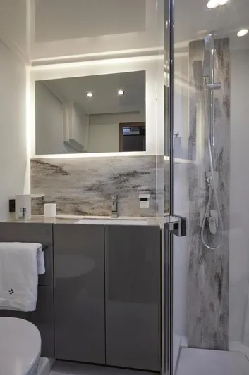  Yacht Photos Pics Modern bathroom in Prestige M48 yacht, 2025 model, featuring sleek fixtures and a glass shower enclosure.