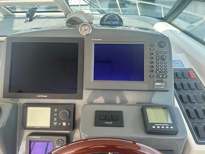 Selladoor (previously "czech Mate") Yacht Photos Pics Control panel of a 2007 Tiara Yachts 4300 Sovran with navigation screens and instruments.