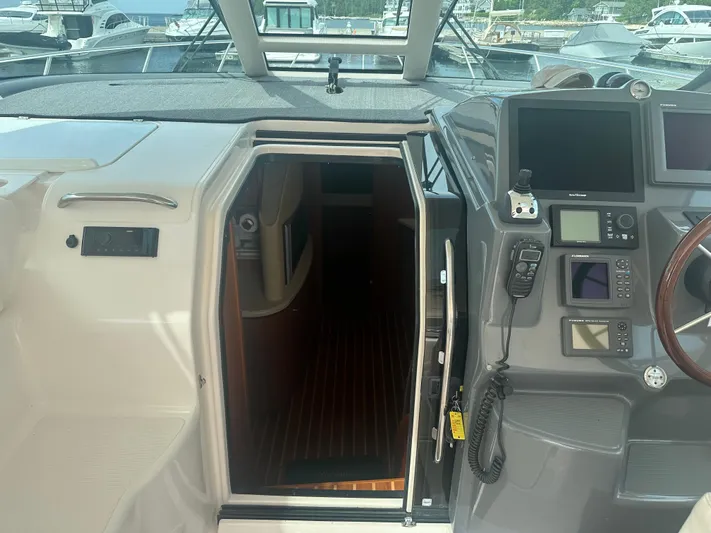 Selladoor (previously "czech Mate") Yacht Photos Pics 2007 Tiara Yachts 4300 Sovran cockpit with navigation equipment and cabin entrance.