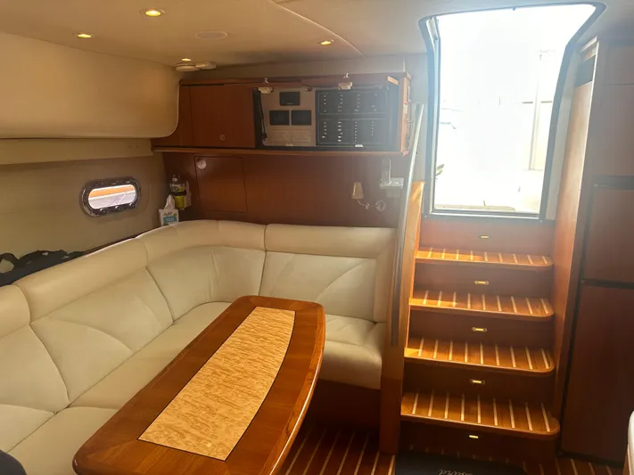 Selladoor (previously "czech Mate") Yacht Photos Pics Interior of 2007 Tiara Yachts 4300 Sovran with plush seating and wooden accents.