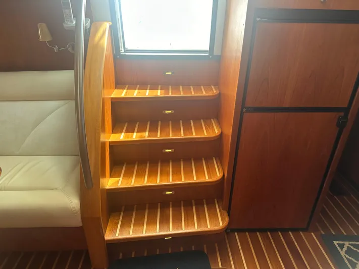 Selladoor (previously "czech Mate") Yacht Photos Pics Interior of 2007 Tiara Yachts 4300 Sovran with wooden stairs and seating.