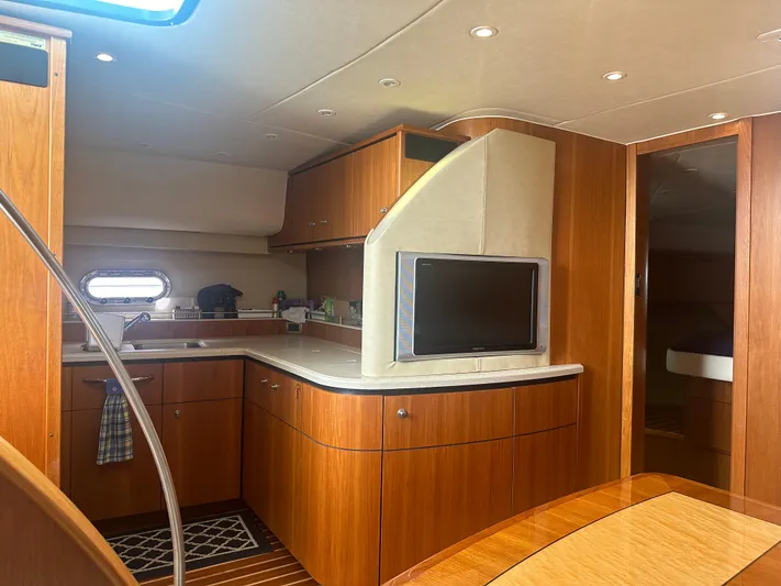 Selladoor (previously "czech Mate") Yacht Photos Pics 2007 Tiara Yachts 4300 Sovran interior with wood cabinetry and modern amenities.
