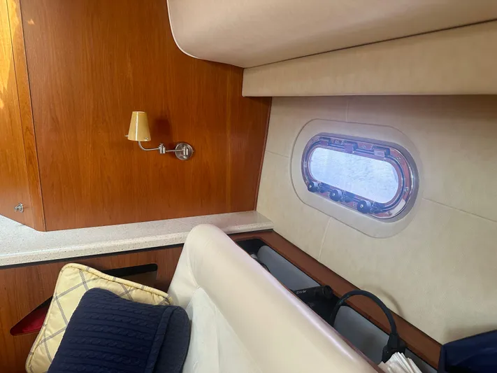 Selladoor (previously "czech Mate") Yacht Photos Pics Interior cabin of 2007 Tiara Yachts 4300 Sovran with window and seating.