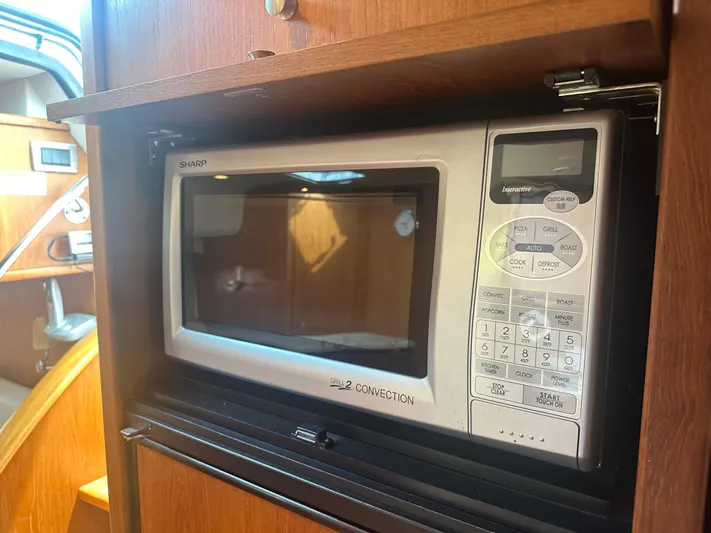 Selladoor (previously "czech Mate") Yacht Photos Pics Microwave in 2007 Tiara Yachts 4300 Sovran interior kitchen area.