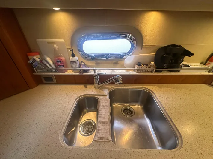 Selladoor (previously "czech Mate") Yacht Photos Pics 2007 Tiara Yachts 4300 Sovran kitchen sink area with window and countertop essentials.
