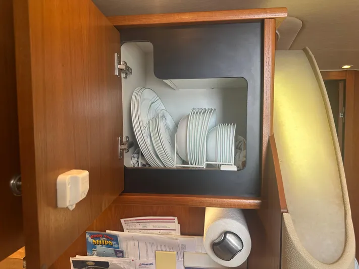 Selladoor (previously "czech Mate") Yacht Photos Pics Cabinet with dishes inside a 2007 Tiara Yachts 4300 Sovran.