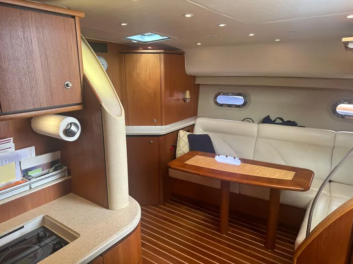 Selladoor (previously "czech Mate") Yacht Photos Pics Interior of 2007 Tiara Yachts 4300 Sovran with wood finish and cozy seating area.