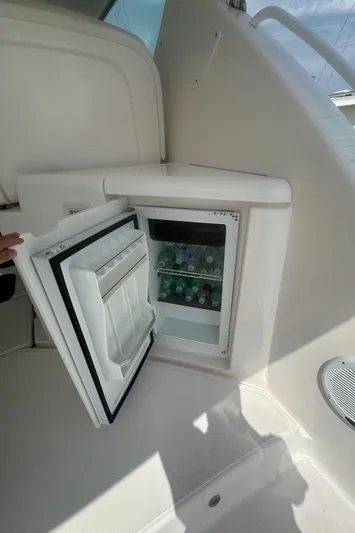 Selladoor (previously "czech Mate") Yacht Photos Pics Open mini fridge on 2007 Tiara Yachts 4300 Sovran, stocked with beverages.