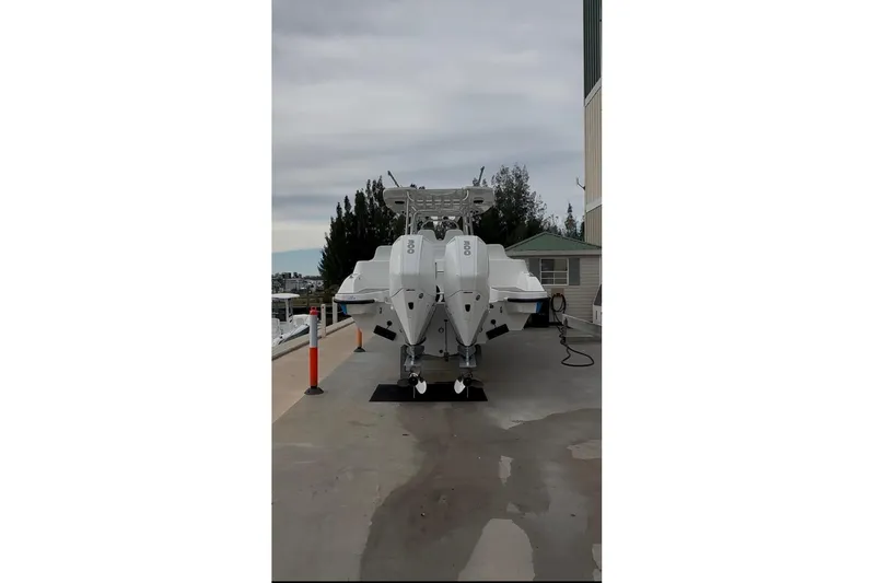  Yacht Photos Pics 2021 Custom Infusion 34 CC boat with twin engines on a dock.