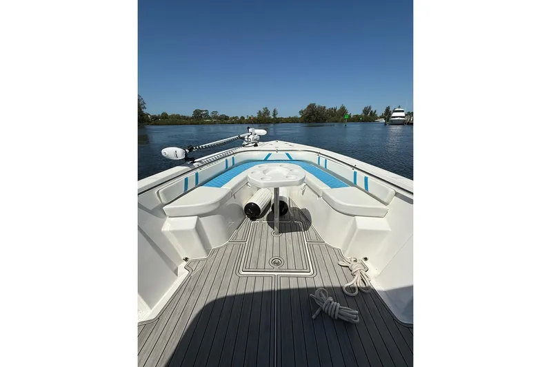  Yacht Photos Pics 2021 Custom Infusion 34 CC boat interior with seating and table on calm water.