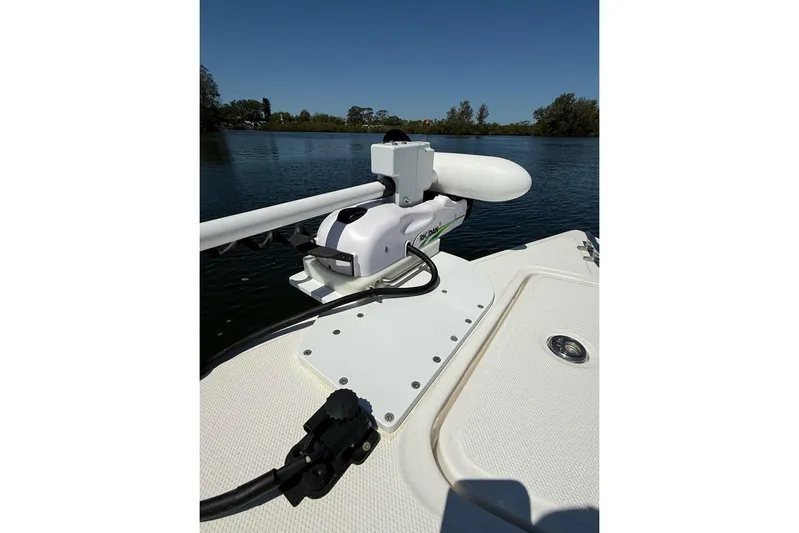  Yacht Photos Pics 2021 Custom Infusion 34 CC boat with mounted trolling motor on calm water.