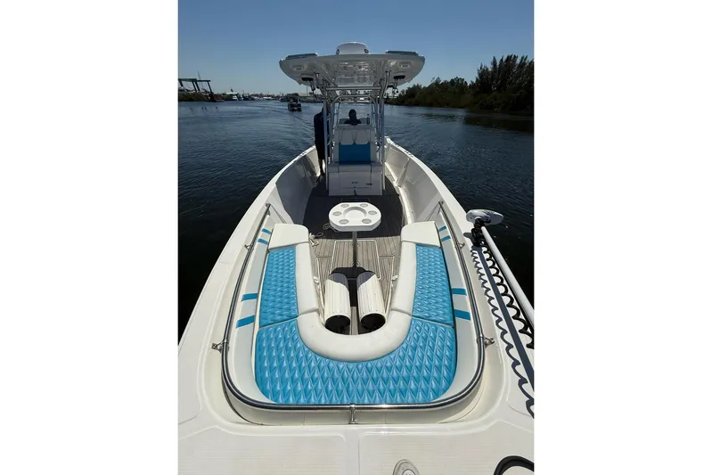  Yacht Photos Pics 2021 Custom Infusion 34 CC boat with blue seating on calm water.