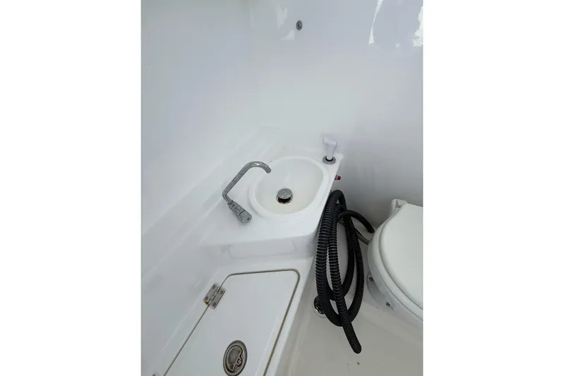 Yacht Photos Pics Boat bathroom with sink, faucet, and coiled hose on Custom Infusion 34 CC, 2021 model.