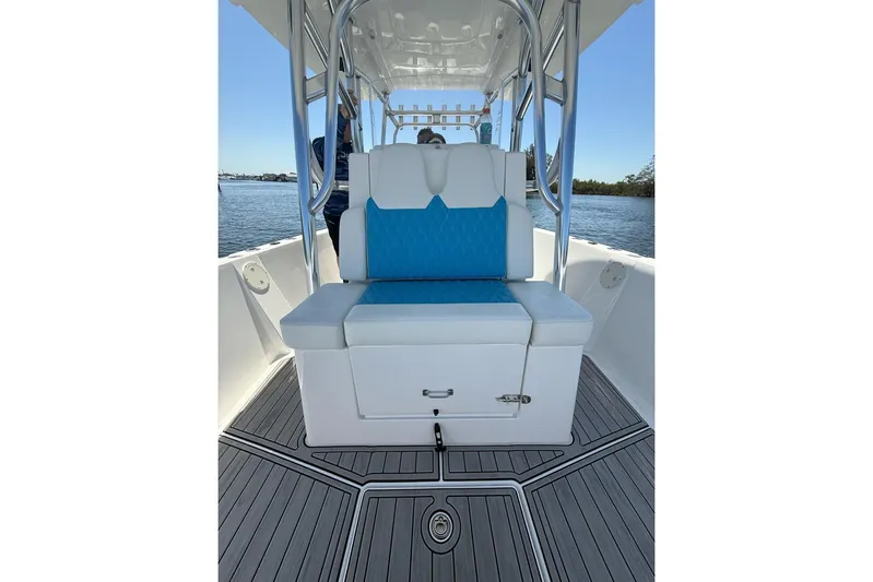  Yacht Photos Pics 2021 Custom Infusion 34 CC boat interior with blue and white seating, on calm water.