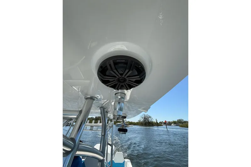  Yacht Photos Pics Custom Infusion 34 CC 2021 boat with speaker system, cruising on a sunny day.
