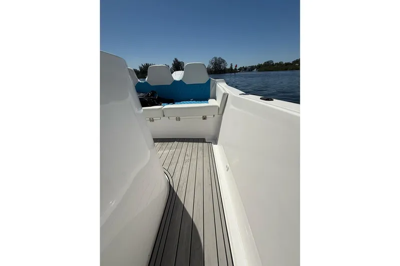  Yacht Photos Pics Custom Infusion 34 CC boat interior, 2021 model, featuring sleek white design and blue seating.