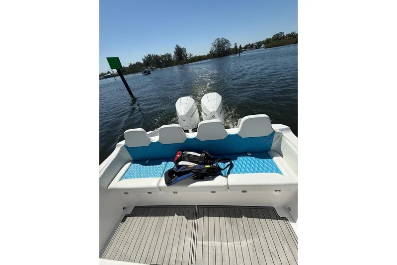  Yacht Photos Pics 2021 Custom Infusion 34 CC boat with twin engines on a sunny day.