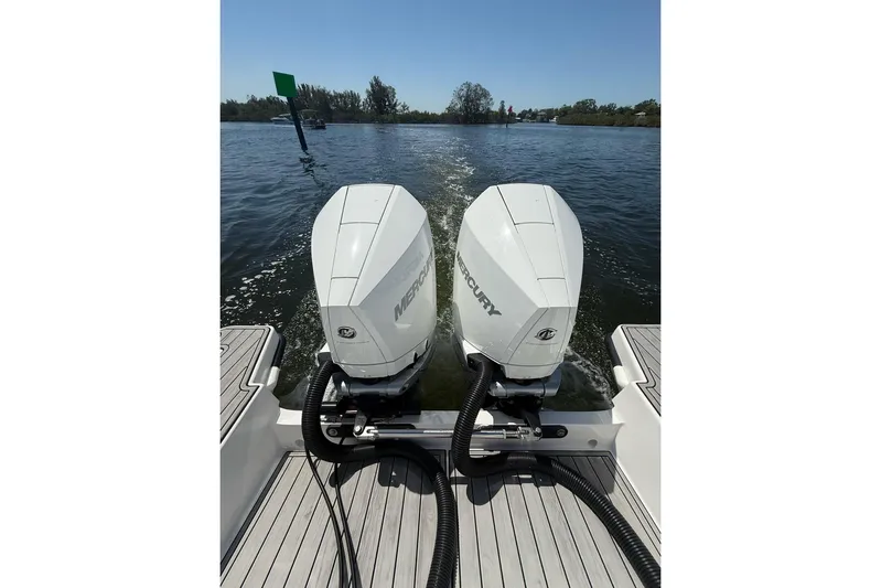  Yacht Photos Pics Twin Mercury outboard engines on 2021 Custom Infusion 34 CC boat, cruising on a sunny day.