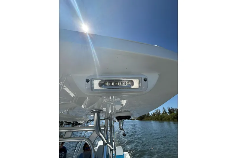  Yacht Photos Pics 2021 Custom Infusion 34 CC boat detail with sunlight and water backdrop.