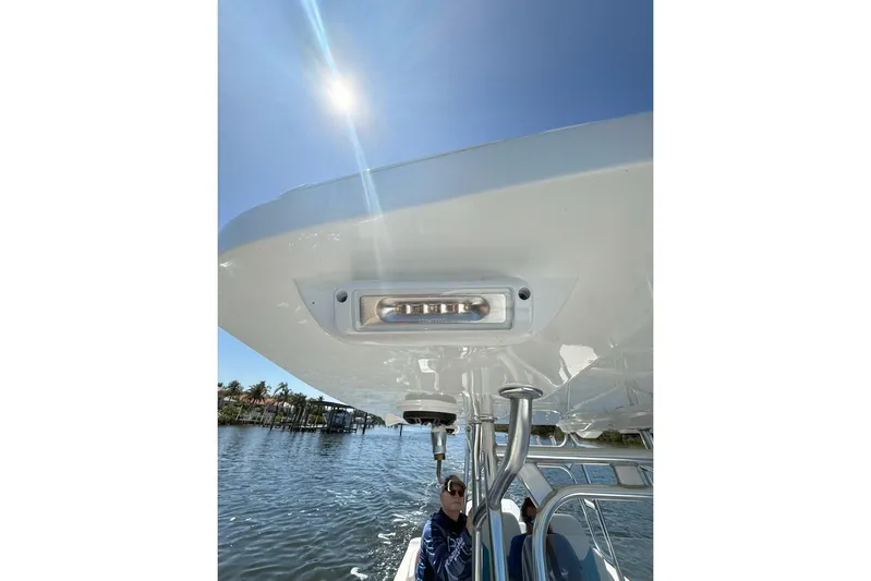  Yacht Photos Pics 2021 Custom Infusion 34 CC boat under sunny sky, featuring sleek design and modern lighting.