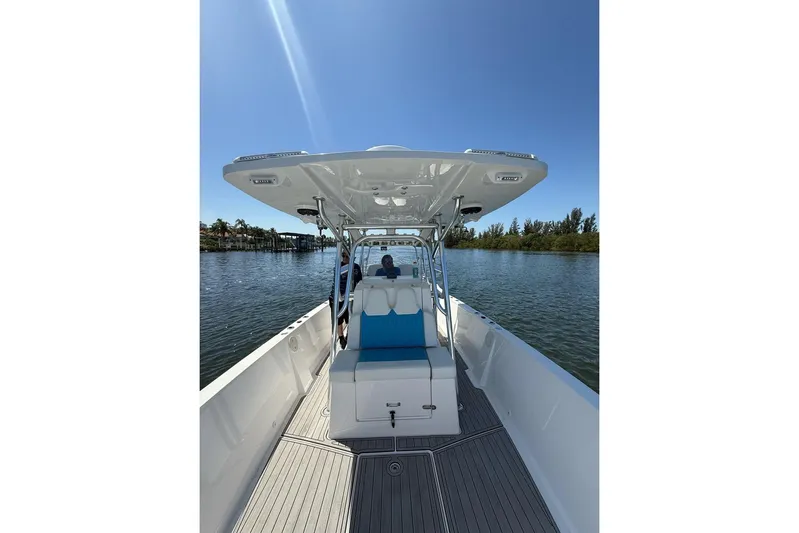  Yacht Photos Pics 2021 Custom Infusion 34 CC boat on calm water under clear blue sky.
