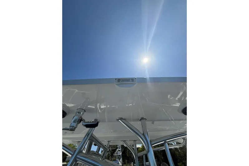  Yacht Photos Pics Custom Infusion 34 CC boat, 2021 model, viewed from below under a bright sunlit sky.
