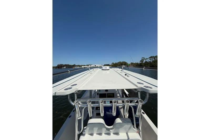  Yacht Photos Pics 2021 Custom Infusion 34 CC boat on calm water under clear blue sky.