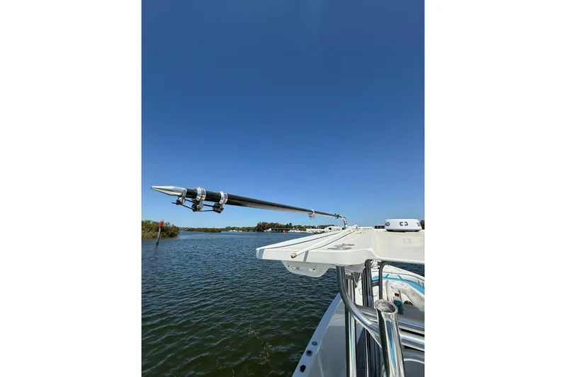  Yacht Photos Pics Custom Infusion 34 CC boat, 2021 model, on calm water under clear blue sky.