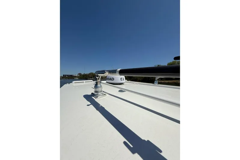  Yacht Photos Pics 2021 Custom Infusion 34 CC boat deck with radar equipment under clear blue sky.
