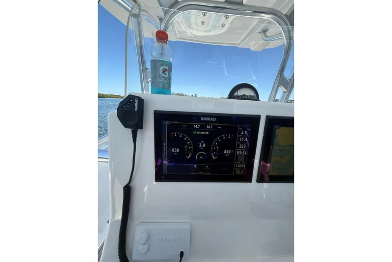  Yacht Photos Pics Center console of 2021 Custom Infusion 34 CC boat with Simrad display and Gatorade bottle.