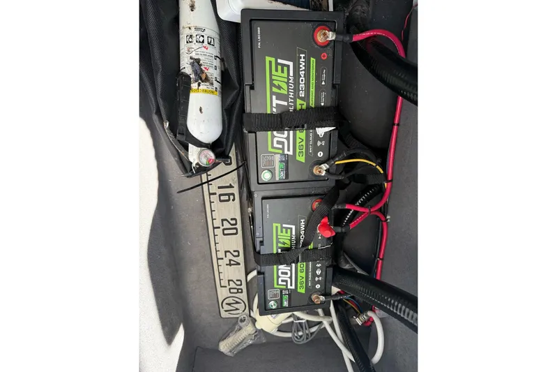  Yacht Photos Pics Three lithium batteries and a fire extinguisher in a Custom Infusion 34 CC boat, 2021 model.