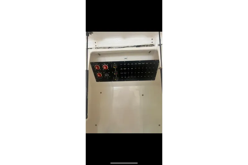  Yacht Photos Pics Electrical panel inside 2021 Custom Infusion 34 CC boat, featuring switches and controls.