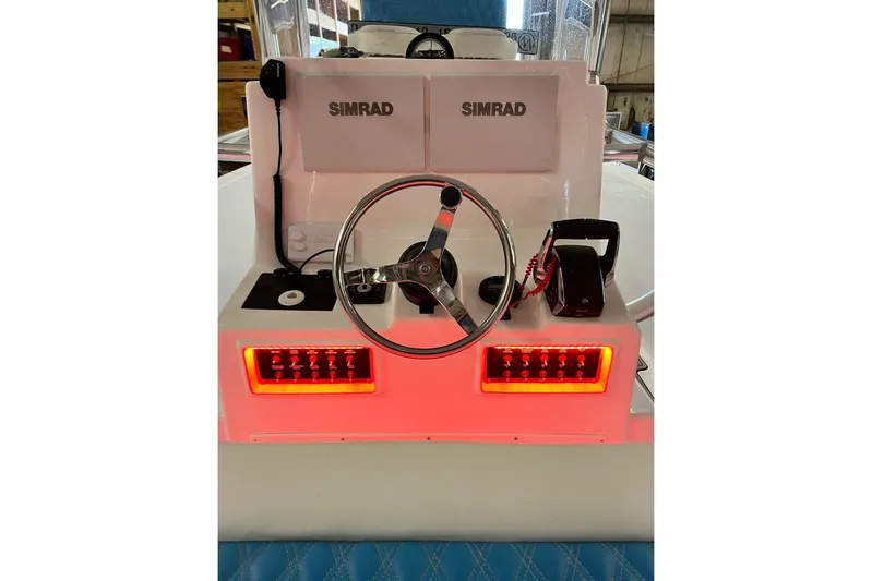  Yacht Photos Pics Center console of 2021 Custom Infusion 34 CC boat with Simrad electronics and illuminated controls.