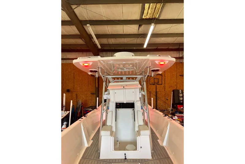  Yacht Photos Pics 2021 Custom Infusion 34 CC boat interior in a warehouse setting.