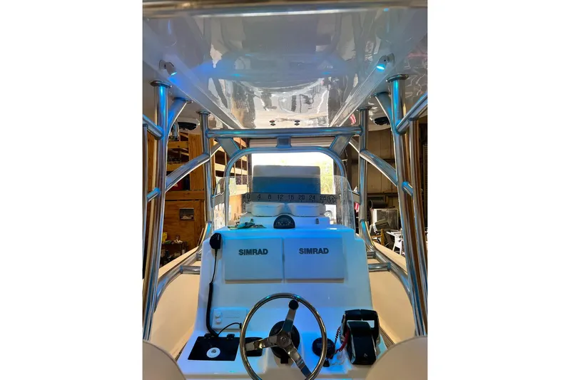  Yacht Photos Pics 2021 Custom Infusion 34 CC boat dashboard with Simrad electronics and steering wheel.