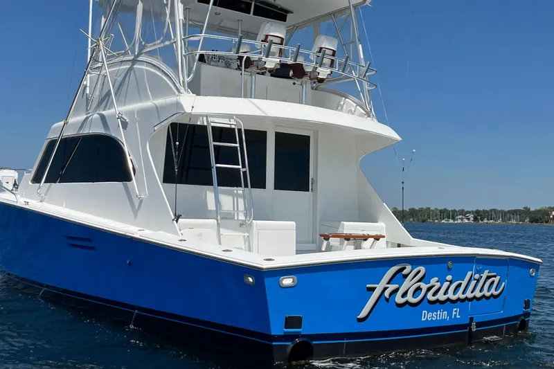 Floridita Yacht Photos Pics 1997 Post Sportfish boat "Floridita" in Destin, FL, on calm waters under clear skies.