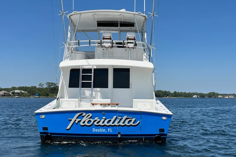 Floridita Yacht Photos Pics 1997 Post Sportfish boat named Floridita in Destin, FL, on calm water.