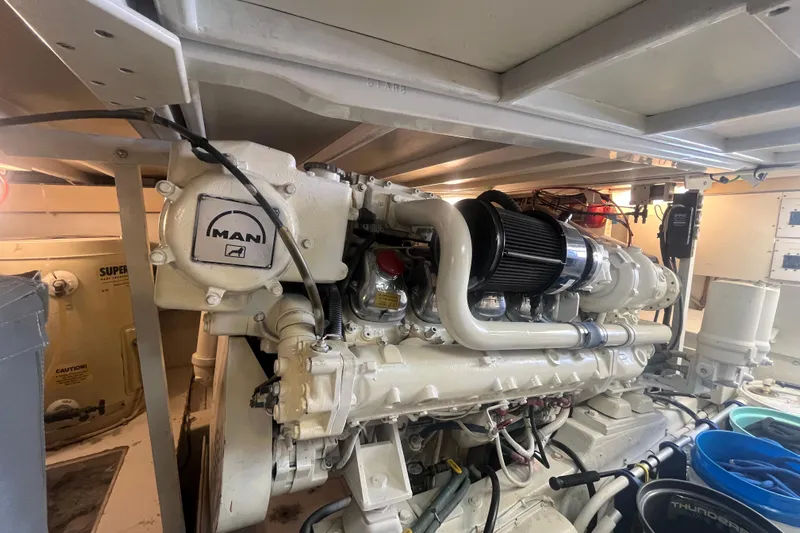 Floridita Yacht Photos Pics Engine room of a 1997 Post Sportfish boat featuring a MAN diesel engine.