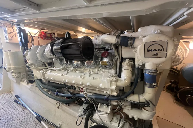 Floridita Yacht Photos Pics Engine room of a 1997 Post Sportfish boat featuring a MAN diesel engine.