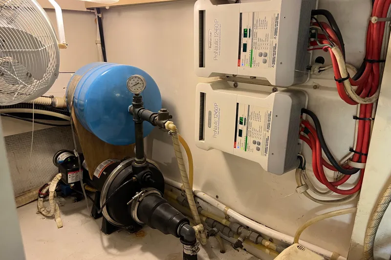 Floridita Yacht Photos Pics Engine room of 1997 Post Sportfish boat with water system and electrical components.