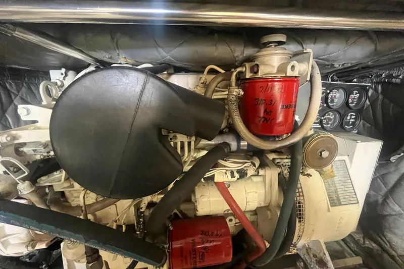 Floridita Yacht Photos Pics Engine compartment of a 1997 Post Sportfish boat, featuring filters and gauges.