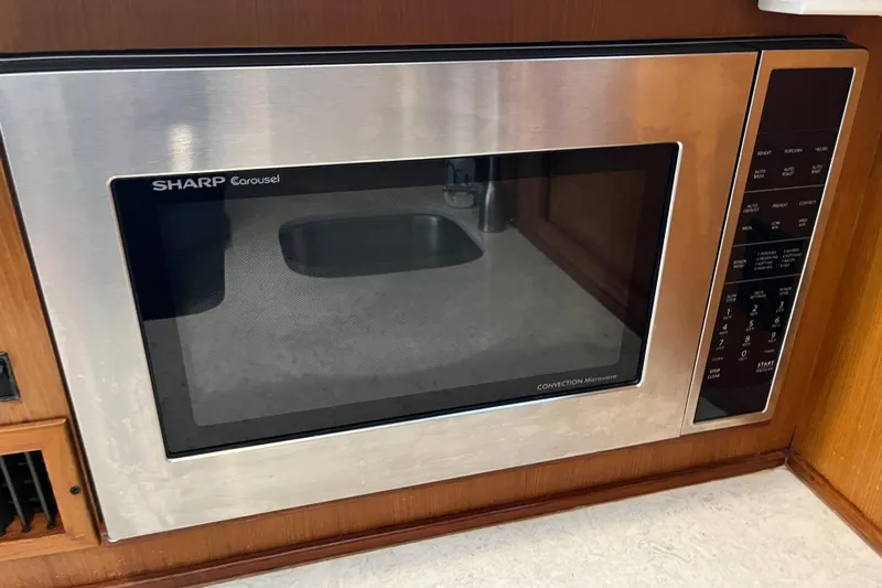 Floridita Yacht Photos Pics Sharp Carousel convection microwave in a 1997 Post Sportfish boat kitchen.