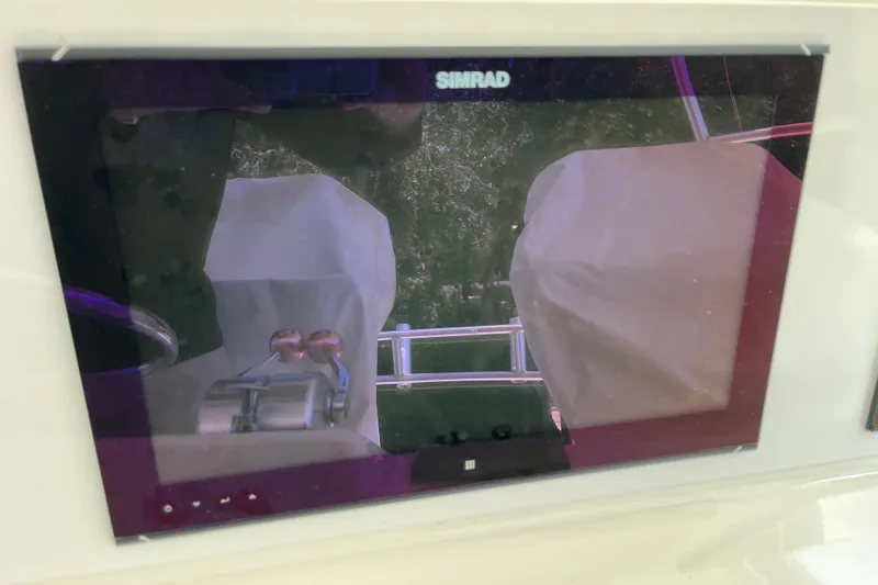 Floridita Yacht Photos Pics Simrad display on 1997 Post Sportfish boat, showing covered controls and railing.