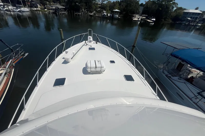 Floridita Yacht Photos Pics 1997 Post Sportfish boat docked in a serene marina setting.