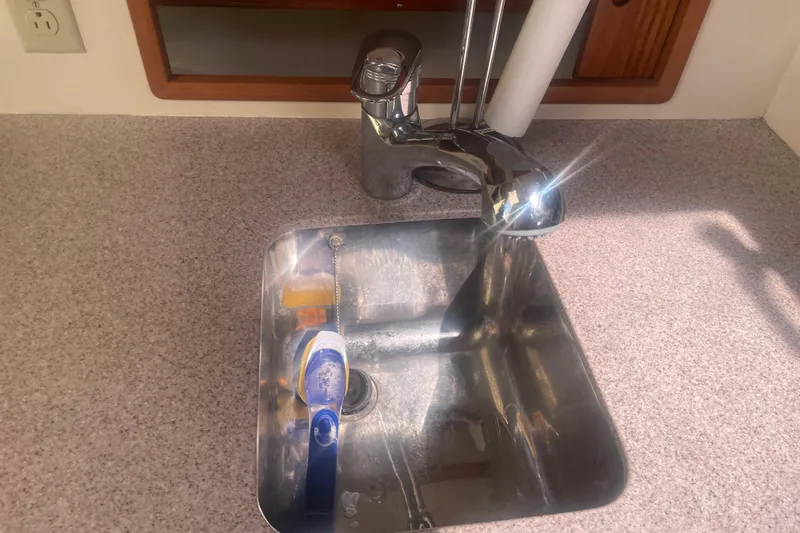 Ripple Yacht Photos Pics Stainless steel sink and faucet in 1998 Little Harbor WhisperJet 36 boat kitchen.